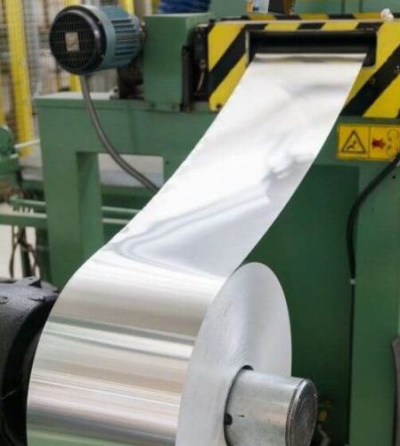 Aluminum roll fed into press mold